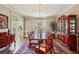 Formal dining room with elegant furnishings, hardwood floors, and a view of the front entrance at 1562 Asheforde Dr, Marietta, GA 30068