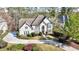 Beautiful home with manicured landscaping, a circular driveway, and an elegant entrance provides curb appeal at 1562 Asheforde Dr, Marietta, GA 30068