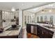 Bright eat-in kitchen features granite counters, stainless steel appliances, hardwood floors and skylight at 1562 Asheforde Dr, Marietta, GA 30068