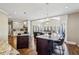 Bright eat-in kitchen with granite counters, stainless steel appliances, hardwood floors and breakfast area with many windows at 1562 Asheforde Dr, Marietta, GA 30068