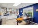 Bright home office with built-in shelving, a large window, and a spacious desk providing an ideal workspace at 1562 Asheforde Dr, Marietta, GA 30068