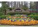 Asheforde community entrance sign surrounded by beautiful colorful flowers at 1562 Asheforde Dr, Marietta, GA 30068