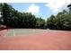 Well-maintained community tennis courts surrounded by lush greenery at 1562 Asheforde Dr, Marietta, GA 30068