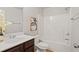 A clean bathroom features a shower-tub combination and dark wood vanity at 2359 Castle Keep Way, Atlanta, GA 30316