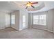 A spacious bedroom with tray ceiling, lots of light, and access to outdoor porch at 2359 Castle Keep Way, Atlanta, GA 30316