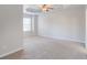 A large carpeted bedroom provides ample space for furniture and decor at 2359 Castle Keep Way, Atlanta, GA 30316