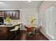 Eat-in kitchen offers dark wood cabinets, a granite countertop, and a bright breakfast nook at 2359 Castle Keep Way, Atlanta, GA 30316
