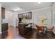 Kitchen with an island, eat-in dining, dark cabinets, stainless appliances, and recessed lighting at 2359 Castle Keep Way, Atlanta, GA 30316