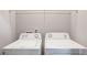 An enclosed laundry area features standard washer and dryer appliances at 2359 Castle Keep Way, Atlanta, GA 30316