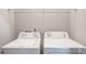 An enclosed laundry area features standard washer and dryer appliances at 2359 Castle Keep Way, Atlanta, GA 30316