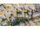 Aerial view of a residential neighborhood with well-maintained lawns, mature trees, and charming homes at 3940 Medlock Park Dr, Snellville, GA 30039