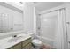 Clean, bright bathroom with shower-tub combo and single sink vanity at 3940 Medlock Park Dr, Snellville, GA 30039