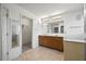 Bathroom boasts a double vanity, tiled floors, and bright lighting at 3940 Medlock Park Dr, Snellville, GA 30039