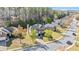 Charming two-story home boasts a well-manicured lawn, mature trees, and inviting curb appeal in a desirable neighborhood at 3940 Medlock Park Dr, Snellville, GA 30039