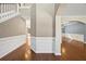 Bright foyer with hardwood floors, staircase and view into dining and living area at 3940 Medlock Park Dr, Snellville, GA 30039