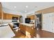 Bright kitchen featuring wood cabinets, white countertops, an island, and stainless appliances at 3940 Medlock Park Dr, Snellville, GA 30039