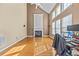 Bright living room with a fireplace, tall ceilings, lots of natural light, and hardwood floors at 3940 Medlock Park Dr, Snellville, GA 30039
