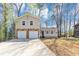 Charming home with stone accents, a covered porch, a two-car garage, and ample parking space at 5307 Mountain Village Ct, Stone Mountain, GA 30083