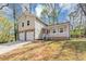 Charming home with stone accents, a covered porch, a two-car garage, and ample parking space at 5307 Mountain Village Ct, Stone Mountain, GA 30083