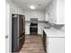 Efficient kitchen with stainless steel appliances, white cabinets, and lots of counter space at 5307 Mountain Village Ct, Stone Mountain, GA 30083