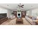 Cozy living room with a fireplace, built-in bookshelves, comfortable seating, and warm lighting at 5307 Mountain Village Ct, Stone Mountain, GA 30083