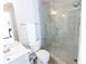 Modern bathroom with a glass shower, updated sink, and neutral wall colors at 5347 Harbury Cv, Suwanee, GA 30024