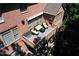 View of multi-story deck with wicker furniture, grill, and awning at 5347 Harbury Cv, Suwanee, GA 30024
