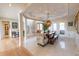 Open-concept dining area with views of the foyer, staircase, and outdoor patio at 5347 Harbury Cv, Suwanee, GA 30024