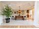 Spacious dining room with marble floors, a rustic dining table, and elegant decor at 5347 Harbury Cv, Suwanee, GA 30024
