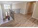 Elegant two-story foyer with hardwood floors, chandelier, wrought iron railing and natural light at 5347 Harbury Cv, Suwanee, GA 30024