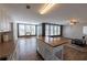 Spacious living room with an island, lots of natural light, and a ceiling fan at 5347 Harbury Cv, Suwanee, GA 30024