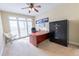 Bright home office with a large desk, natural light, and a Liberty Safe for security at 5347 Harbury Cv, Suwanee, GA 30024