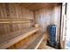 Sauna interior featuring wooden benches and a bucket for water to create the perfect steam at 5347 Harbury Cv, Suwanee, GA 30024