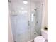 New glass shower features marble tiling, a shower caddy, and modern fixtures at 5347 Harbury Cv, Suwanee, GA 30024