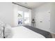 Bedroom featuring windows with modern curtains, white trim, and view to outdoors at 335 Skylar Se Way, Atlanta, GA 30315