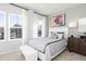 Cozy bedroom with two large windows, a comfortable bed, and modern decor at 335 Skylar Se Way, Atlanta, GA 30315