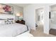 Bedroom featuring a bed, nightstand, and doorway to an adjoining bathroom at 335 Skylar Se Way, Atlanta, GA 30315