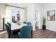 Bright dining room with stylish accents and a view to a nearby bathroom at 335 Skylar Se Way, Atlanta, GA 30315