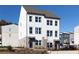 Attractive two-story townhome with white siding, a brick base, and a welcoming front entrance at 335 Skylar Se Way, Atlanta, GA 30315