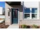 Inviting front entrance with a stylish door, modern address plaque, and brick facade with nice plants at 335 Skylar Se Way, Atlanta, GA 30315