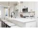 Island kitchen with white countertops and bar seating at 335 Skylar Se Way, Atlanta, GA 30315