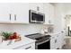 Close-up of modern kitchen featuring white countertops and stainless steel appliances at 335 Skylar Se Way, Atlanta, GA 30315