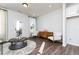 Bright living room with modern furnishings, stylish decor, and wood-look flooring at 335 Skylar Se Way, Atlanta, GA 30315