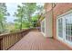 Expansive wooden deck offers an outdoor area for relaxation and entertainment with a backyard view at 5611 Manassas Run, Stone Mountain, GA 30087