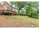 View of the backyard, deck, and lush greenery at 5611 Manassas Run, Stone Mountain, GA 30087