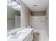 This bathroom has a white sink and vanity with a tiled shower/tub at 5611 Manassas Run, Stone Mountain, GA 30087