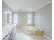 The bathroom has a luxurious corner tub, dual sinks and white tile flooring at 5611 Manassas Run, Stone Mountain, GA 30087