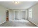 This bedroom offers two large closets and a window for natural light at 5611 Manassas Run, Stone Mountain, GA 30087