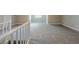 Bonus room with light gray carpeting and a staircase at 5611 Manassas Run, Stone Mountain, GA 30087