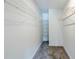 Walk-in closet with carpet, wire shelving for storage at 5611 Manassas Run, Stone Mountain, GA 30087